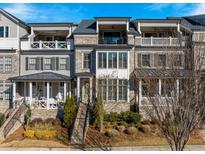 Charming townhome with brick and siding, featuring multiple balconies and well-maintained landscaping at 364 Concord St, Alpharetta, GA 30009