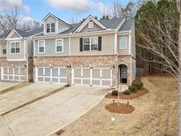 Charming townhome with brick accents, attached two-car garage, and well-maintained landscaping at 96 Trailview Lane Ln, Hiram, GA 30141