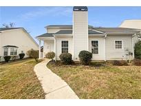 Charming home with a walkway leading to the front door and a well-maintained lawn at 2341 Wellington Cir, Lithonia, GA 30058