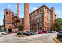 Renovated brick mill with two smokestacks converted into apartments with parking and green space at 170 Boulevard Se # H416, Atlanta, GA 30312