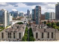 Stunning aerial view of community buildings in a city, offering convenient access to the vibrant urban core at 1075 Peachtree Walk # A-307, Atlanta, GA 30309