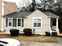 Charming single-story home featuring a cozy front porch and well-maintained landscaping at 6473 Bedford Ln, Lithonia, GA 30058