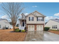Charming two-story home with a two-car garage and inviting front porch at 224 Berkley Dr, Villa Rica, GA 30180