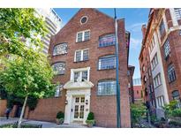 Stately brick building showcasing traditional architecture and lush greenery enhancing curb appeal at 93 Peachtree Ne Pl # 5, Atlanta, GA 30309