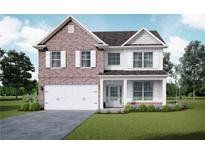 Charming two-story brick home with white trim, a manicured lawn, and a two-car garage at 5995 Spring Way, Stonecrest, GA 30038
