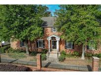 Charming brick home with a manicured lawn and lush, mature trees adding to its curb appeal at 6700 Roswell Rd # 32C, Atlanta, GA 30328