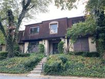 Charming multi-level townhouse with mature landscaping and a welcoming entrance at 3060 Parc Lorraine, Lithonia, GA 30038