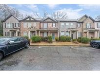 Charming townhome exterior featuring a well-maintained facade and inviting front entrance at 1616 Bayrose Cir, East Point, GA 30344