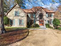 Stunning two-story home boasting a manicured lawn, double-door entry, and refined architectural accents at 600 Dalmore Dr, Duluth, GA 30097