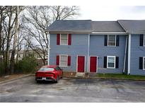 Charming townhouse with blue siding and red door, perfect for a cozy home at 2726 Evans Mill Dr, Lithonia, GA 30058