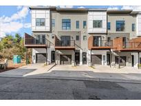 Modern townhome exterior featuring private balconies, garage spaces, and contemporary architectural design at 2333 Mason Dr # D26, Atlanta, GA 30316