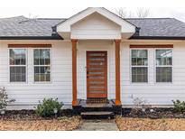 Charming home featuring a modern front door with glass panels and bright, fresh paint at 1466 Venetian Sw Dr, Atlanta, GA 30311