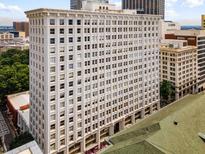 Classic white high-rise building with large windows, offering historic architecture and urban living at 57 Forsyth Nw St # 9G, Atlanta, GA 30303
