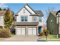 Charming two-story home with a two-car garage, beautiful landscaping, and inviting curb appeal at 5835 Sterling Ct, Cumming, GA 30040