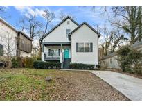 Charming renovated two-story home with a welcoming front porch and beautiful curb appeal at 139 Dahlia Nw Ave, Atlanta, GA 30314