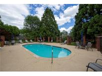 Enjoy this community pool surrounded by lush trees and plenty of seating for those hot summer days at 1406 Winston Pl, Decatur, GA 30033
