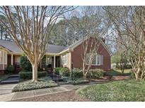 Charming brick home with manicured landscaping and a welcoming front entrance at 1406 Winston Pl, Decatur, GA 30033