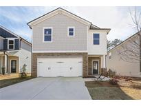 Charming two-story home with stone accents and a spacious two-car garage at 2777 Aralynn Way, College Park, GA 30337