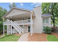 Inviting two-story condo with covered porch and well-maintained landscaping, located in a desirable community at 1905 Countryside Se Pl # 1905, Smyrna, GA 30080