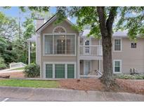 Inviting two-story condo with charming balcony and well-maintained landscaping at 1905 Countryside Se Pl # 1905, Smyrna, GA 30080