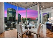 Bright dining area featuring floor-to-ceiling windows with city views and modern furnishings at 3324 Peachtree Ne Rd # 1219, Atlanta, GA 30326