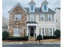Charming two-story home featuring a stone facade and complementary siding at 1580 Reids Ferry Way, Marietta, GA 30062