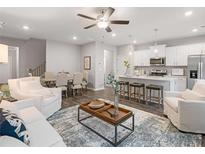 Open concept living area flows into dining and kitchen, offering modern living space at 5603 Hislop Ln # 79, Mableton, GA 30126