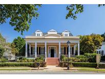 Charming home featuring a welcoming front porch, dormer windows and professionally landscaped yard at 3786 Turnberry Ct, Duluth, GA 30096