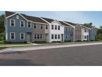 Row of new two-story townhomes, each with varied facade colors and unique architectural details at 2105 Stillhaven Pl, Douglasville, GA 30135