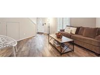 Cozy living room featuring wood floors and a comfortable couch at 3251 Abbeywood Dr, Decatur, GA 30034