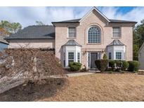 Charming brick home features a well-manicured lawn and classic architectural details at 2971 Montview Sw Dr, Marietta, GA 30060
