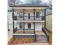 Beautiful two-story home with a charming double front porch and modern design elements at 727 Garibaldi Sw St, Atlanta, GA 30310