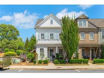 Charming two-story home boasts tidy landscaping, a cozy front porch, and a well-maintained exterior at 122 Brighton Blvd, Woodstock, GA 30188