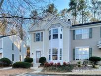 Charming townhome featuring a bay window, neutral siding and attractive landscaping at 9155 Nesbit Ferry Rd # 79, Alpharetta, GA 30022