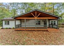 Charming single-story home with a spacious front porch and a cozy, inviting atmosphere at 2205 Stockbridge Se Dr, Atlanta, GA 30316