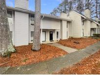 Charming townhouse featuring a classic design, neat landscaping, and a welcoming entrance at 4409 Idlewood Ln, Tucker, GA 30084