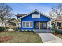 Charming blue craftsman home with a welcoming front porch and well-maintained landscaping at 726 Brookline Sw St, Atlanta, GA 30310