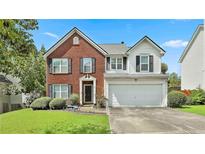 Charming two-story home with a well-manicured lawn and a two-car garage in a great neighborhood at 2726 Northgate Nw Way, Acworth, GA 30101