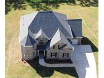 An aerial view showcases this two story house and its yard at 8013 White Stone Blvd, Douglasville, GA 30135