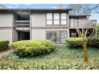 Charming condo with manicured landscaping and multiple windows at 223 Smokerise Se Cir, Marietta, GA 30067
