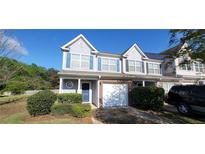 Charming townhome with brick accents, attached garage, and well-maintained landscaping at 770 Parkway Rd, Union City, GA 30291