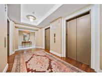 Hallway decorated with rug and leading to the elevator at 3630 Peachtree Ne Rd # 1809, Atlanta, GA 30326