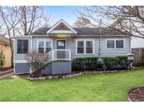 Charming bungalow featuring a well-maintained front lawn, covered porch, and welcoming curb appeal at 681 Home Se Ave, Atlanta, GA 30312