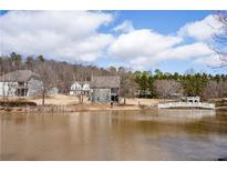 Scenic water view showing a foot bridge over the pond and well-maintained landscaping at 15 Lakeside Way, Cartersville, GA 30121