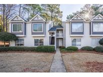 Attractive townhouse with neutral siding, dark trim, and well-maintained landscaping at 101 Fair Haven Se Way, Smyrna, GA 30080
