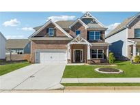 Beautiful two-story brick home with a well-manicured lawn and inviting entrance at 744 Clark Lake Estates Dr, Grayson, GA 30017
