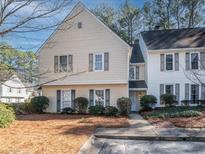 Charming townhouse with a well-maintained lawn and traditional architectural details at 4126 N Gloucester Pl, Atlanta, GA 30341