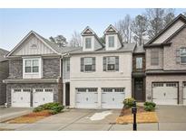 Charming townhome with two-car garage and stone and brick facade at 1989 Brightleaf Way # 143, Marietta, GA 30060