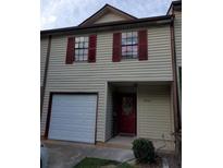 Two-story home featuring red shutters and a single-car garage at 2303 Pine Tree Trl, Atlanta, GA 30349