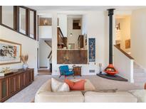 Spacious living room with unique fireplace, stylish furnishings, and an open floor plan at 3897 Allsborough Dr, Tucker, GA 30084